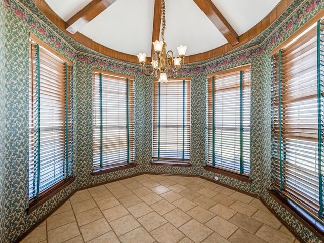 unfurnished dining area with light tile patterned floors, an inviting chandelier, and wallpapered walls