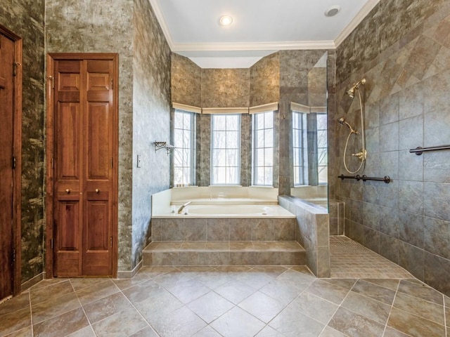 bathroom with tile patterned flooring, a garden tub, crown molding, and a walk in shower