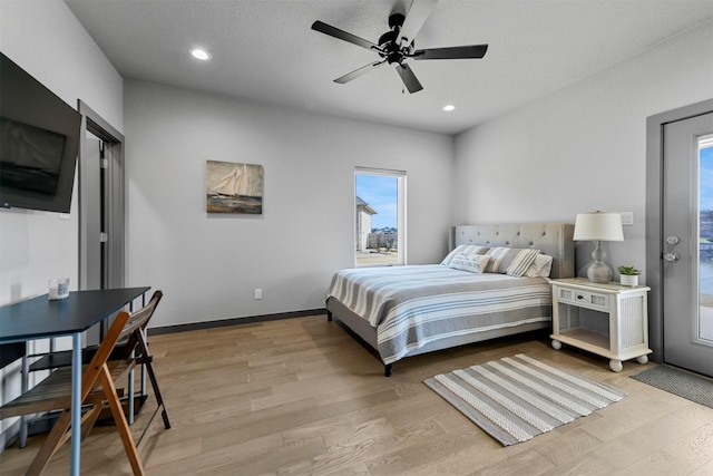 bedroom featuring recessed lighting, light wood-type flooring, and baseboards