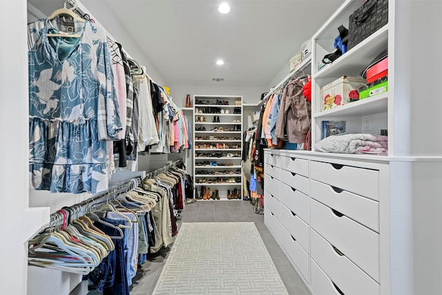 walk in closet with light tile patterned floors and visible vents