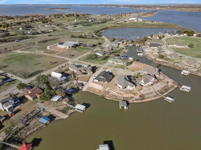 bird's eye view featuring a water view and a residential view