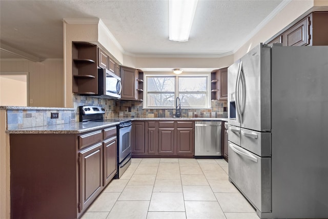 kitchen featuring open shelves, ornamental molding, appliances with stainless steel finishes, and a sink