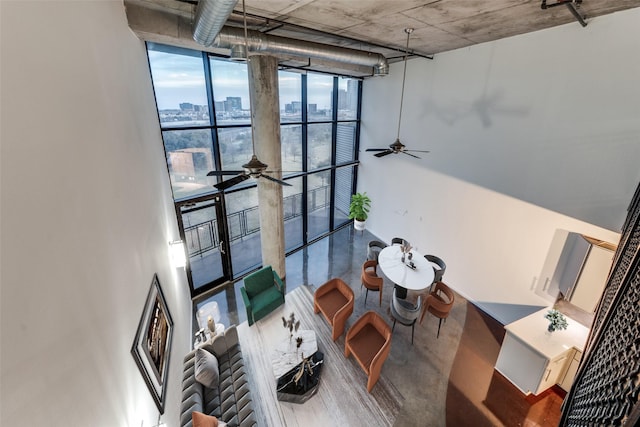 interior space featuring a city view and a wall of windows