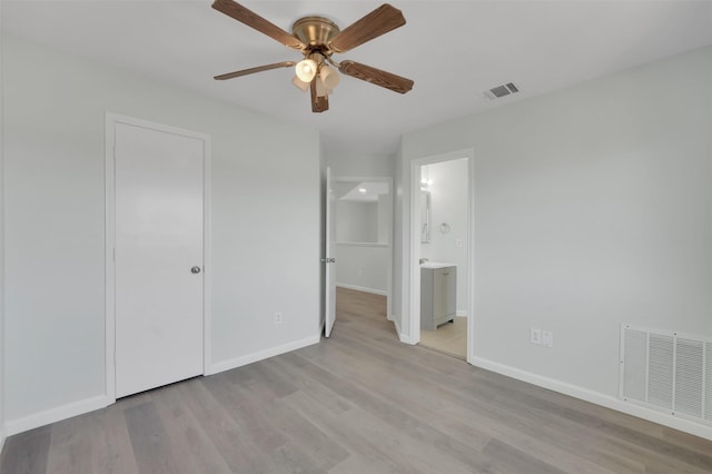 unfurnished bedroom featuring visible vents, baseboards, and light wood-style flooring