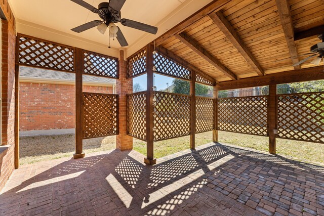 view of patio with a fenced backyard and a ceiling fan