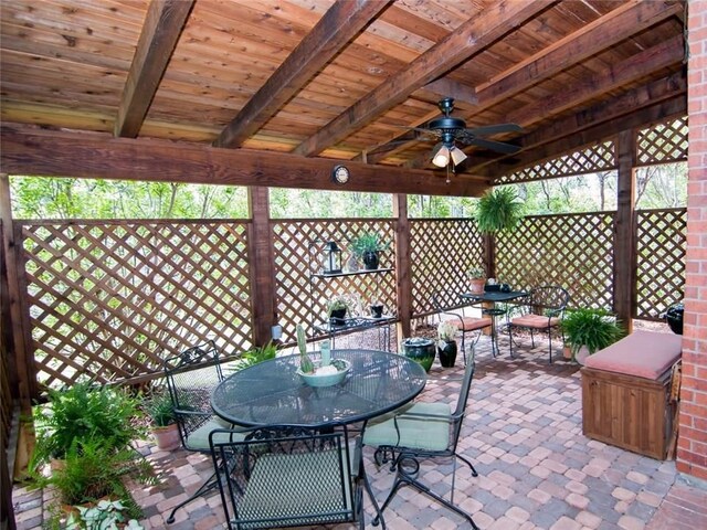 view of patio / terrace featuring outdoor dining area and a ceiling fan