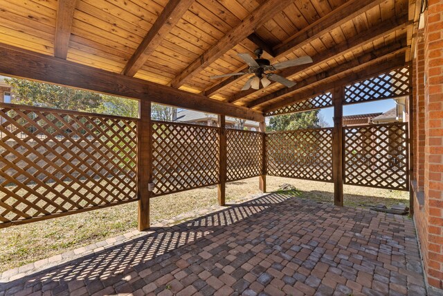 view of patio / terrace featuring a ceiling fan and fence