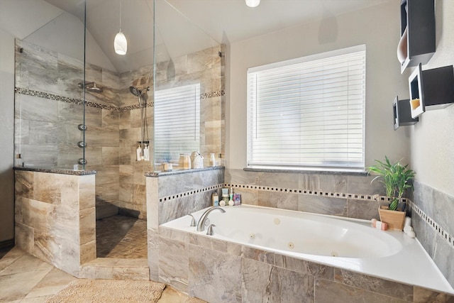 full bath with lofted ceiling, a tub with jets, and a tile shower