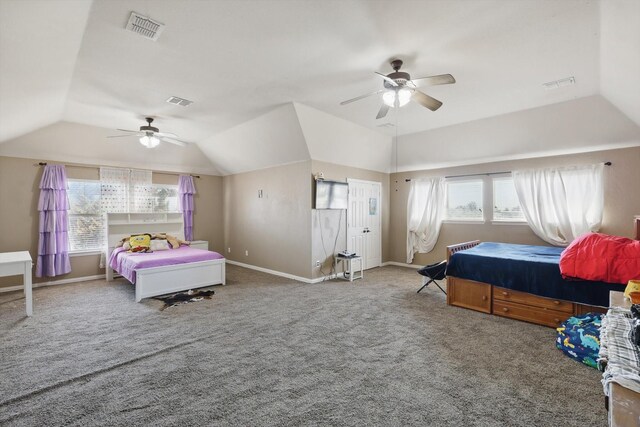 bedroom featuring visible vents, multiple windows, and vaulted ceiling