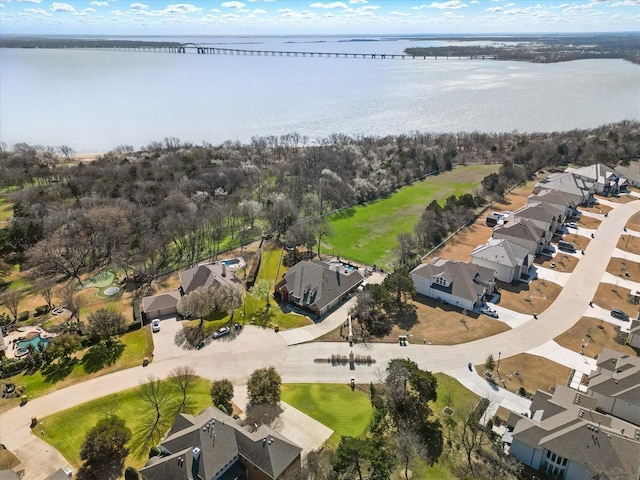 bird's eye view featuring a water view and a residential view