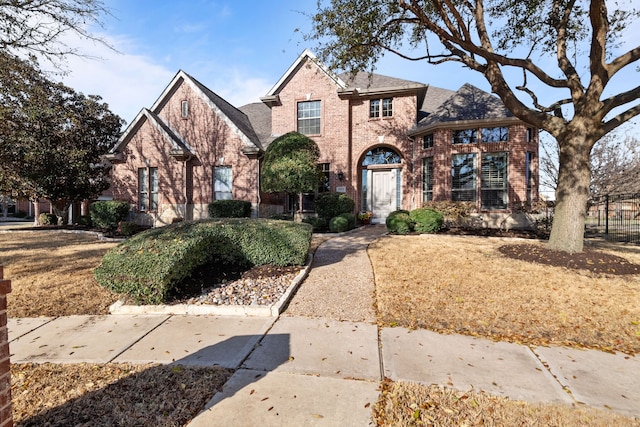 traditional-style house with brick siding