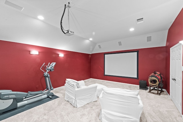 carpeted cinema room featuring recessed lighting, visible vents, and vaulted ceiling