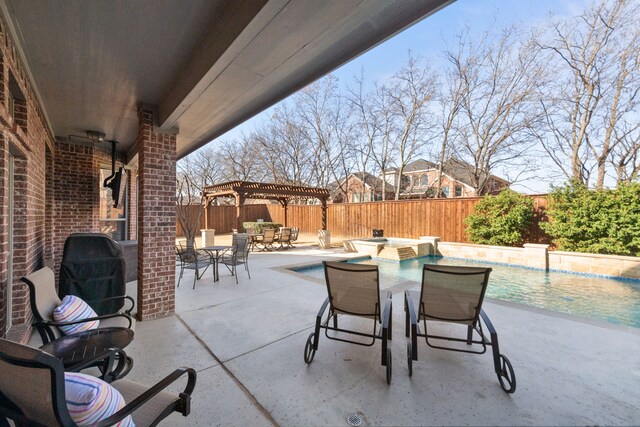 view of patio featuring outdoor dining space, a fenced backyard, a pergola, and a pool with connected hot tub