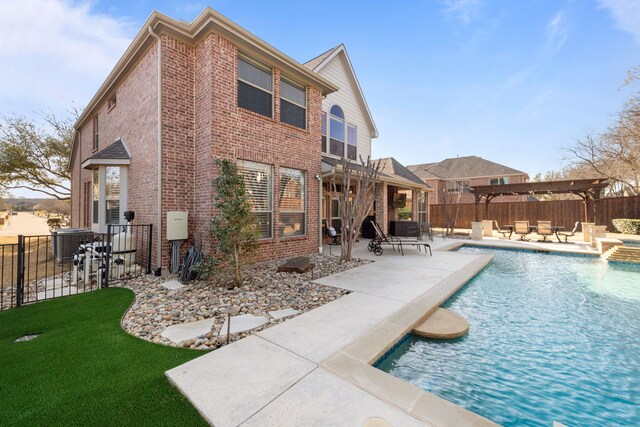 view of pool with a fenced in pool, central air condition unit, an outdoor fire pit, a fenced backyard, and a patio