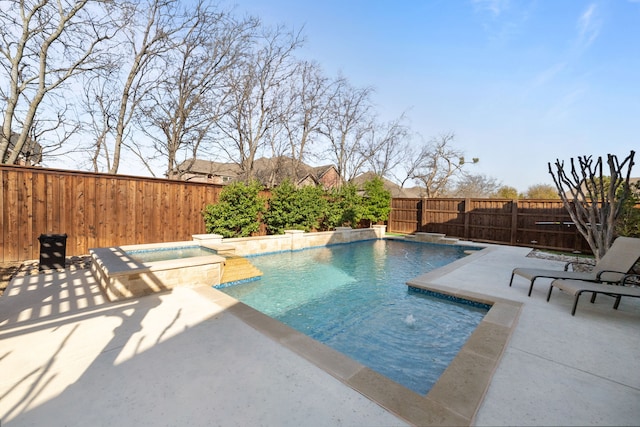 view of swimming pool with a patio, a fenced backyard, and a pool with connected hot tub