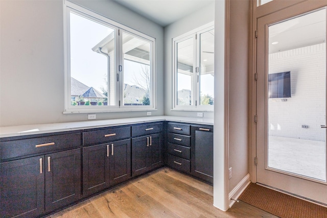 kitchen with light wood-style floors and light countertops