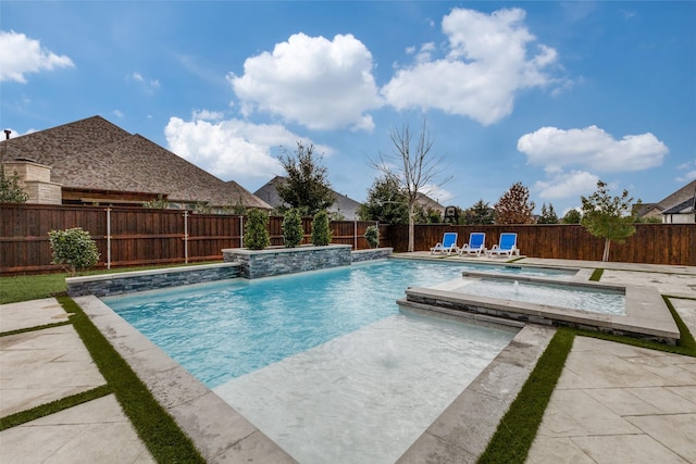 view of pool featuring a fenced in pool, an in ground hot tub, a fenced backyard, and a patio area