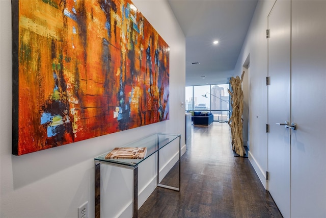 hallway with recessed lighting and wood finished floors