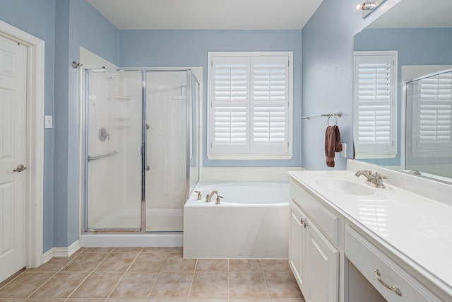 bathroom featuring vanity, tile patterned floors, a garden tub, and a stall shower