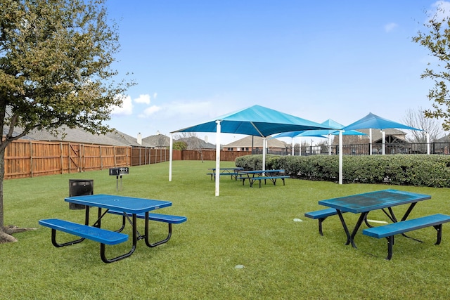 view of play area with a yard and fence