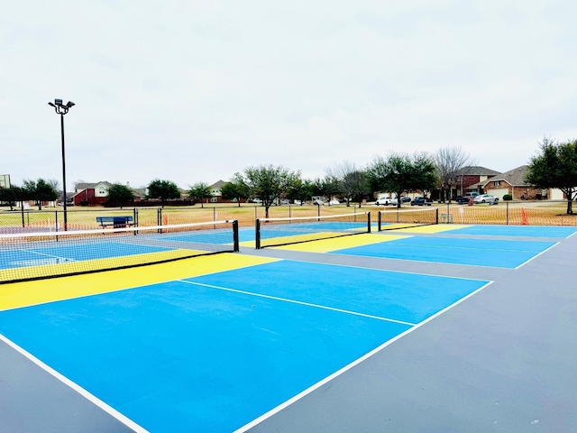 view of sport court with community basketball court and fence