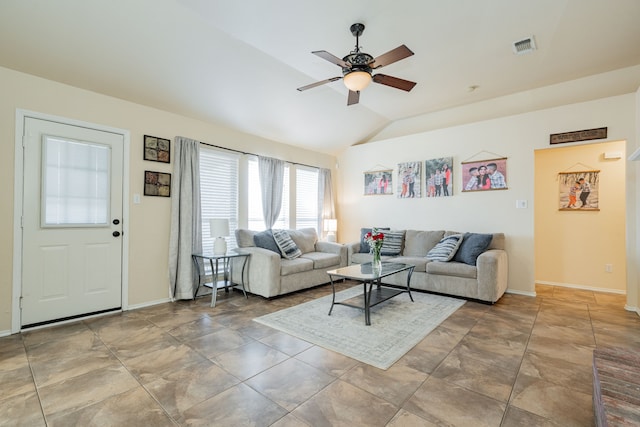 living area with lofted ceiling, a ceiling fan, visible vents, and baseboards