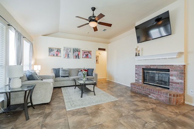 living room with visible vents, a brick fireplace, baseboards, lofted ceiling, and a ceiling fan