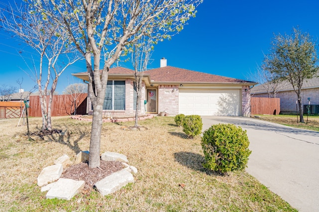 ranch-style home featuring driveway, fence, a garage, brick siding, and a chimney