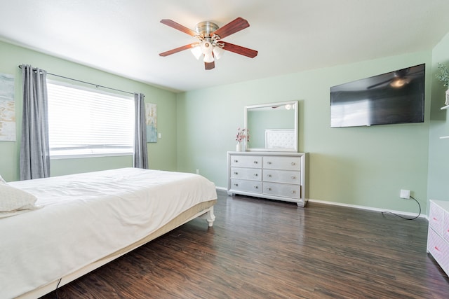 bedroom featuring a ceiling fan, wood finished floors, and baseboards