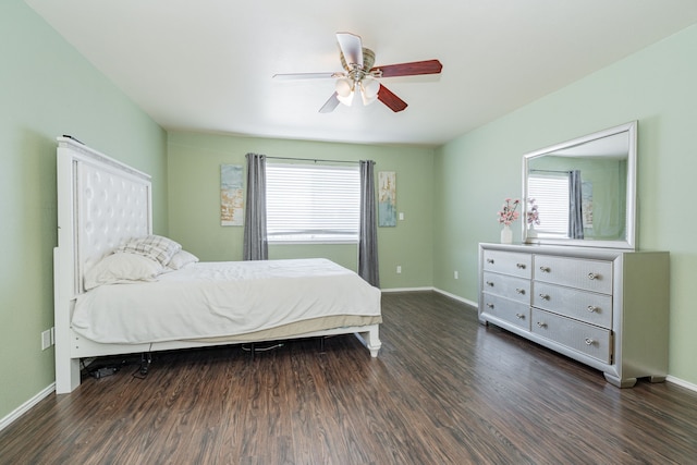 bedroom with baseboards, wood finished floors, and a ceiling fan