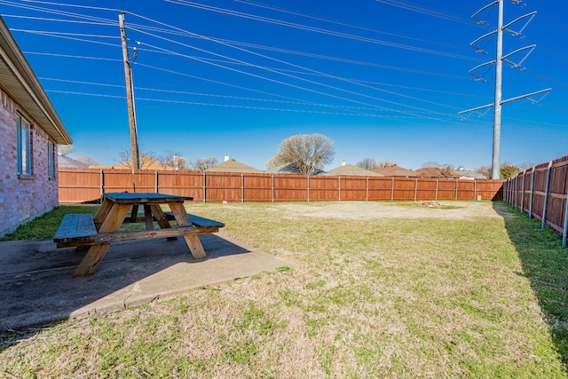 view of yard featuring a patio and a fenced backyard