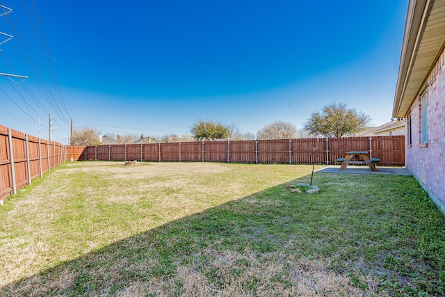 view of yard with a fenced backyard