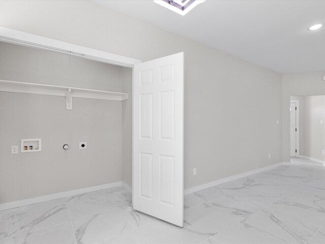 interior space with hookup for an electric dryer, washer hookup, hookup for a gas dryer, marble finish floor, and laundry area