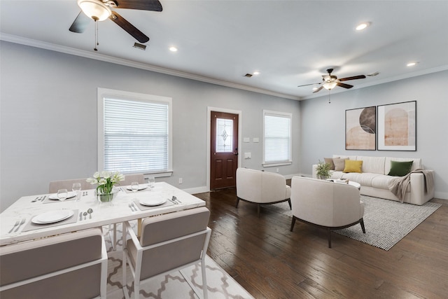 living area featuring ornamental molding, baseboards, a ceiling fan, and dark wood-style flooring