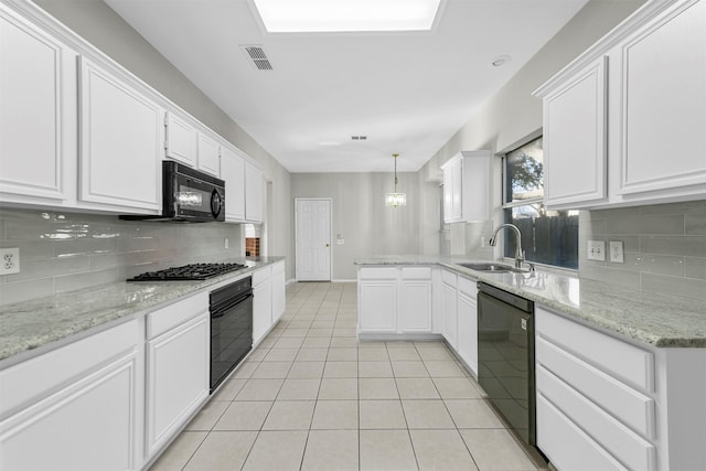 kitchen with light tile patterned floors, visible vents, a sink, black appliances, and white cabinets