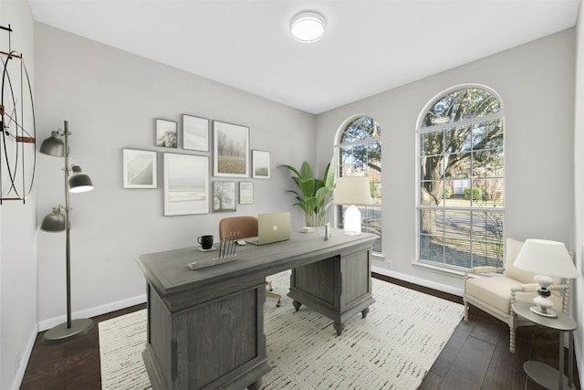 office space featuring dark wood-style floors and baseboards