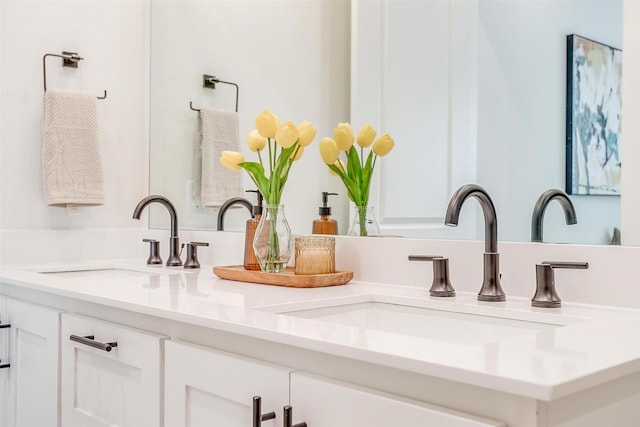 interior details with double vanity and a sink