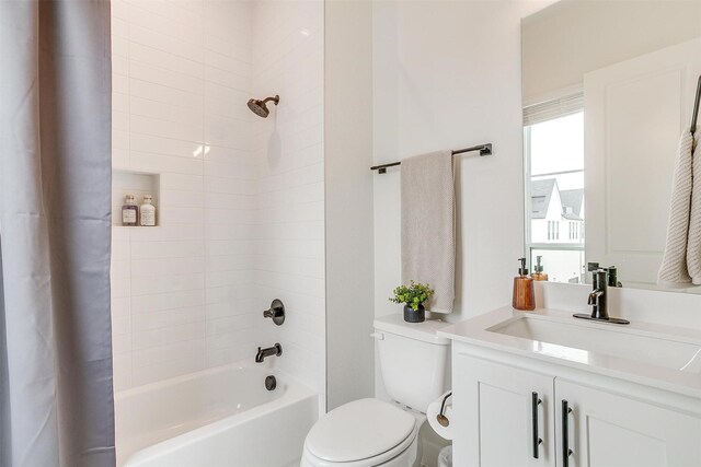 full bath with vanity, toilet, and shower / tub combo with curtain