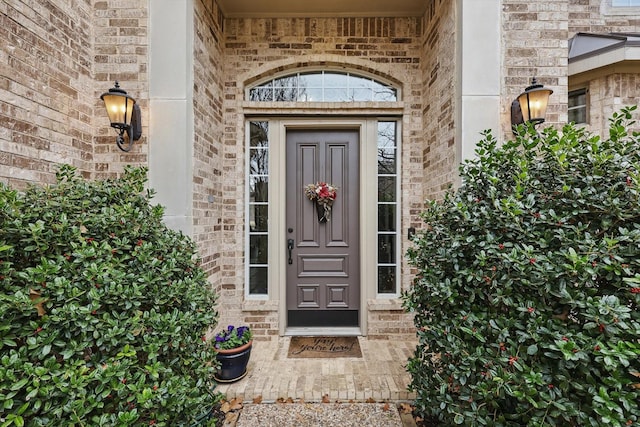 entrance to property with brick siding