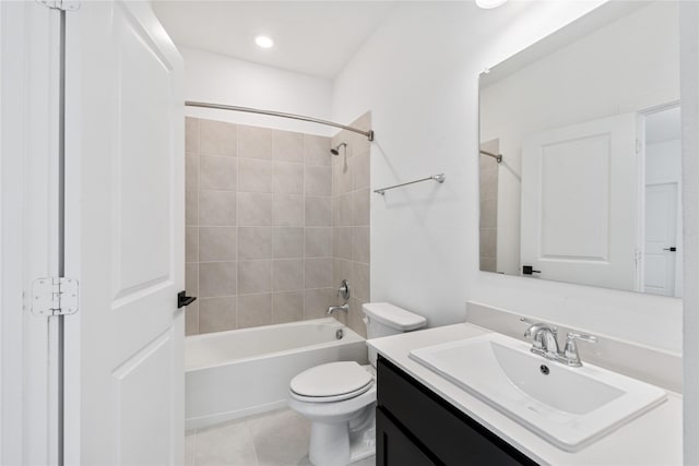 bathroom with bathtub / shower combination, toilet, vanity, and tile patterned flooring