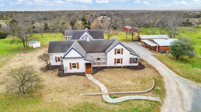 drone / aerial view with a view of trees