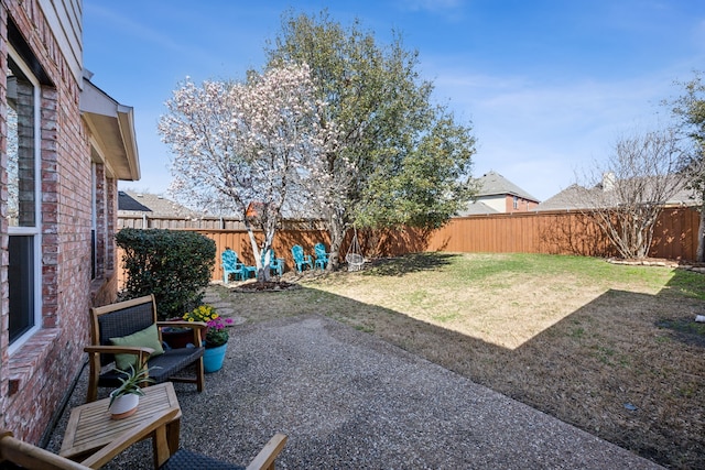 view of yard with a fenced backyard