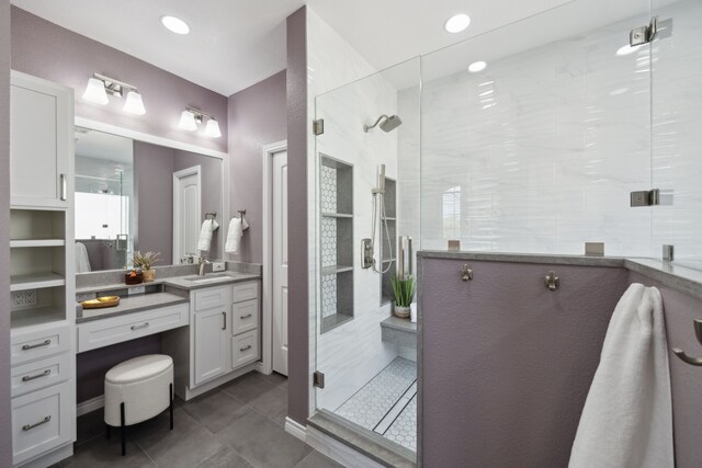 bathroom with vanity, recessed lighting, a stall shower, and tile patterned flooring