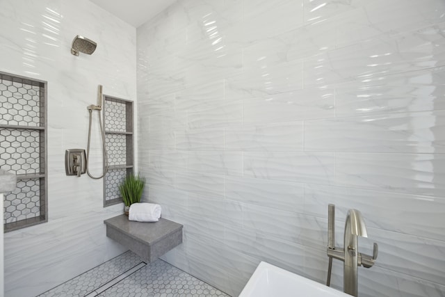 bathroom featuring a shower, tile walls, and a sink