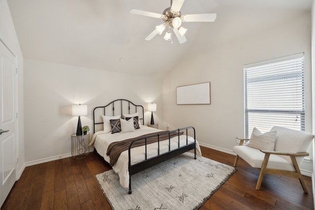 bedroom featuring ceiling fan, baseboards, lofted ceiling, and hardwood / wood-style flooring