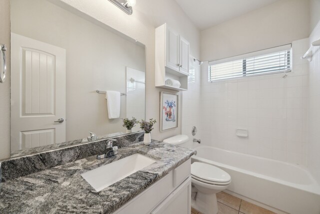 full bath with tile patterned flooring, shower / bathing tub combination, toilet, and vanity