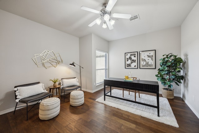 interior space with visible vents, a ceiling fan, baseboards, and hardwood / wood-style floors