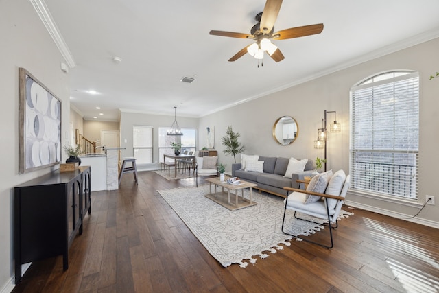 living room featuring visible vents, crown molding, ceiling fan, stairs, and dark wood-style flooring