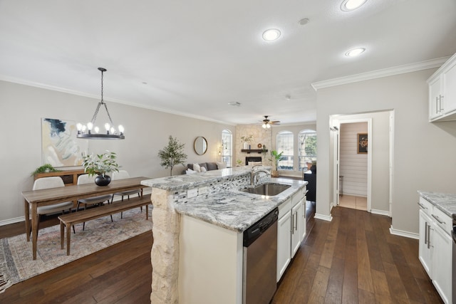 kitchen with dark wood-style flooring, dishwasher, crown molding, and a sink