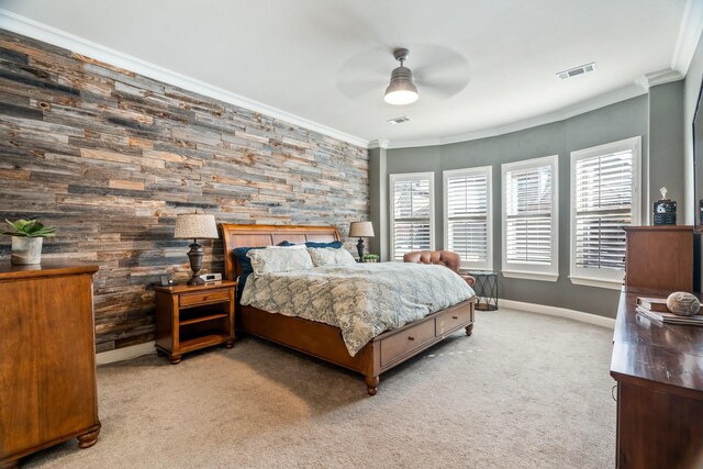 bedroom featuring crown molding, multiple windows, and visible vents